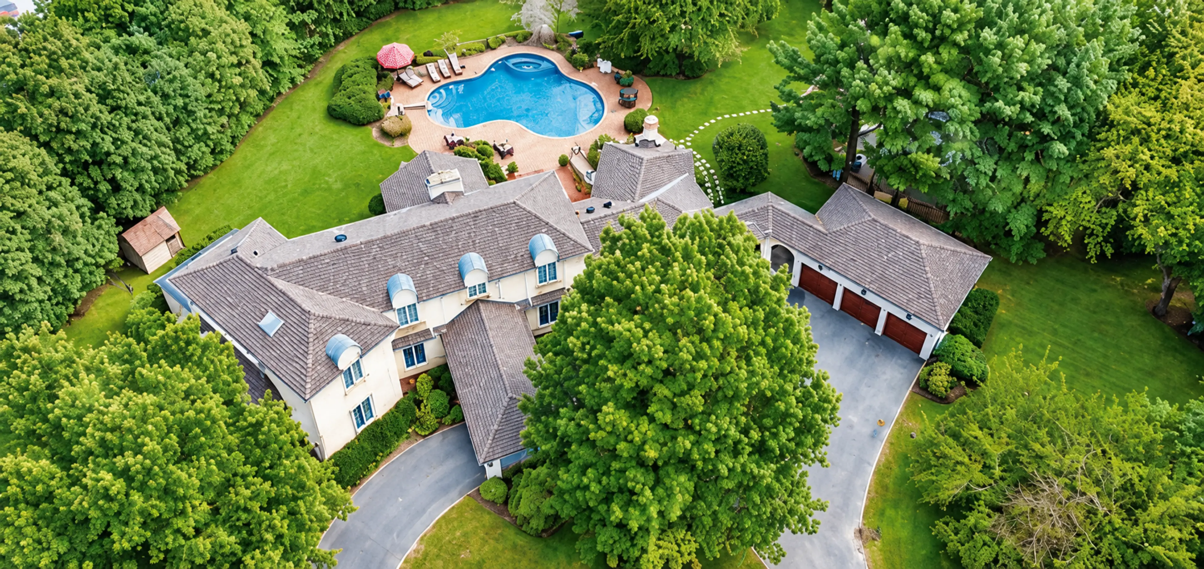 Aerial view of a residence with a pool